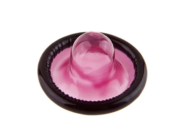 Preservativos rosa sobre fundo branco — Fotografia de Stock