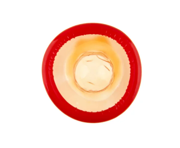 Condón rojo sobre fondo blanco —  Fotos de Stock