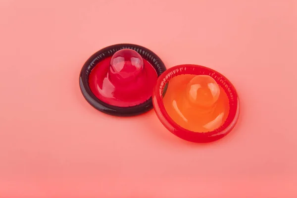 Condom on pink background closeup — Stock Photo, Image