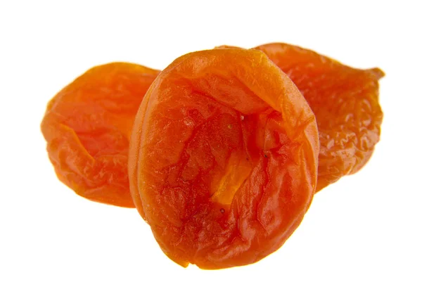 Torkade aprikoser på vit bakgrund — Stockfoto