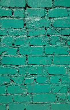 yeşil renkte boyalı eski tuğla duvar