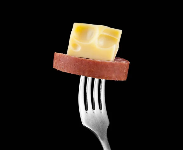 Sausage and cheese on a fork — Stock Photo, Image