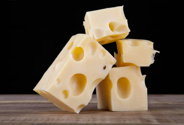 Cheese isolated on a black background — Stock Photo, Image