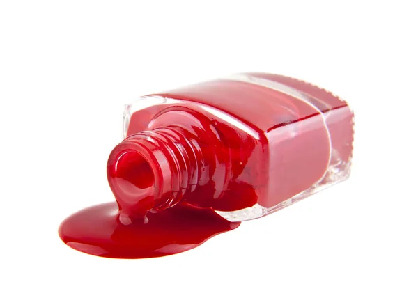 Frasco com esmalte vermelho isolado sobre fundo branco — Fotografia de Stock