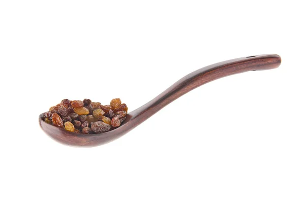 Raisins in a wooden spoon isolated on white background — Stock Photo, Image