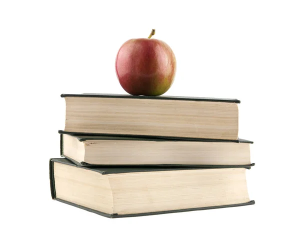 Books and an apple isolated on a white background close-up — Stock Photo, Image