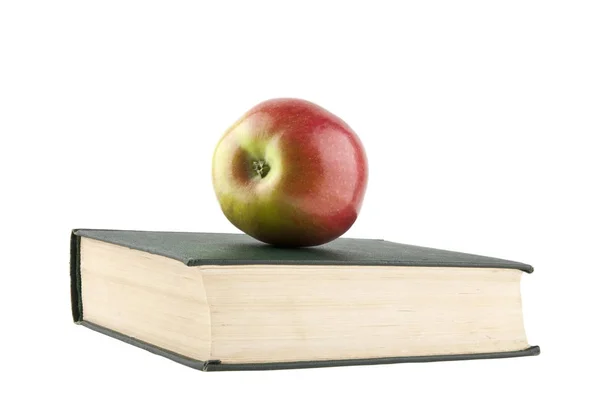 Livres et une pomme isolé sur un fond blanc close-up — Photo