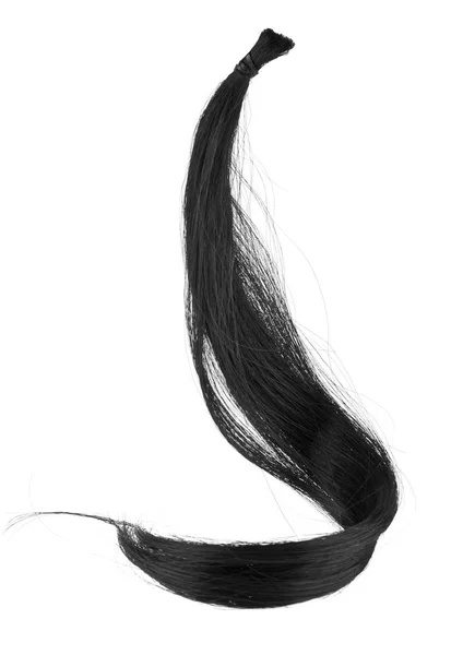Вьющиеся черные волосы на белом фоне крупным планом — стоковое фото