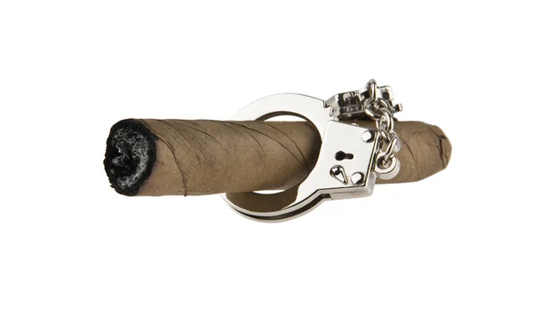 Cigar in handcuffs isolated on white background — Stock Photo, Image