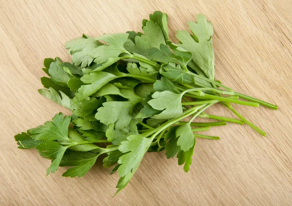 Parsley on a wooden background — Stock Photo, Image
