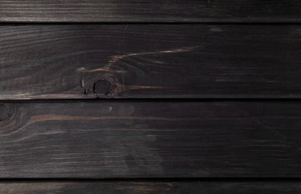 Textura de un fondo de madera negro — Foto de Stock