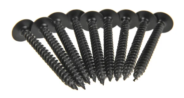 Schwarze selbstschneidende Schrauben isoliert auf weißem Hintergrund — Stockfoto