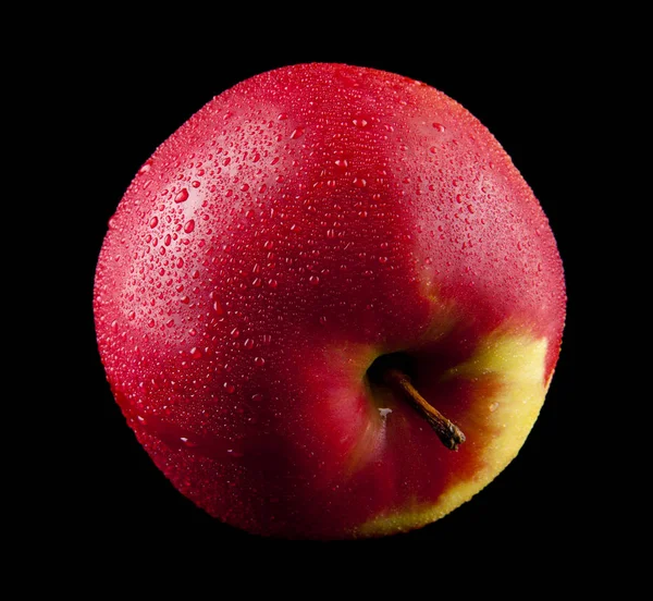 Red apple in drops of water on a black background — Stock Photo, Image