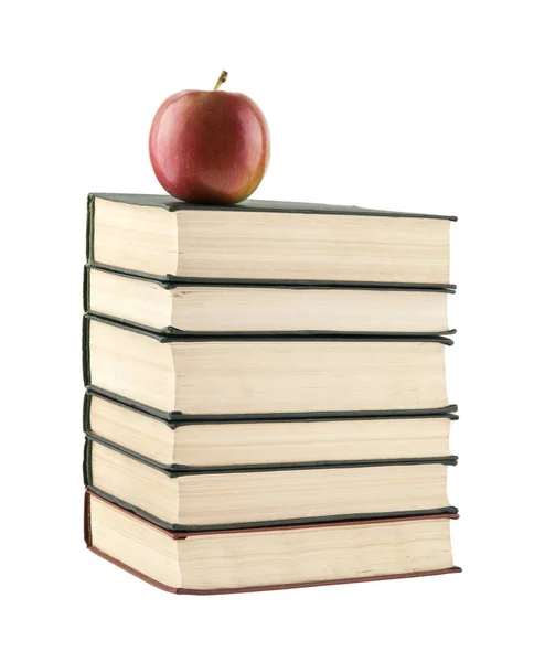 Κόκκινο μήλο και το βιβλίο που απομονώνονται σε λευκό φόντο — Φωτογραφία Αρχείου