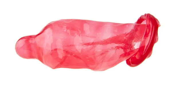 Preservativo rosso isolato su sfondo bianco — Foto Stock