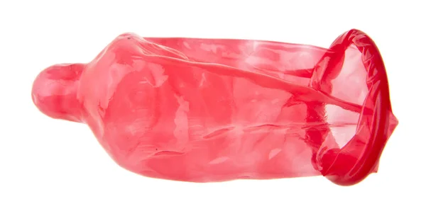 Rood condoom geïsoleerd op witte achtergrond — Stockfoto