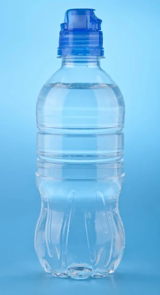 Bottle of water on a blue background — Stock Photo, Image