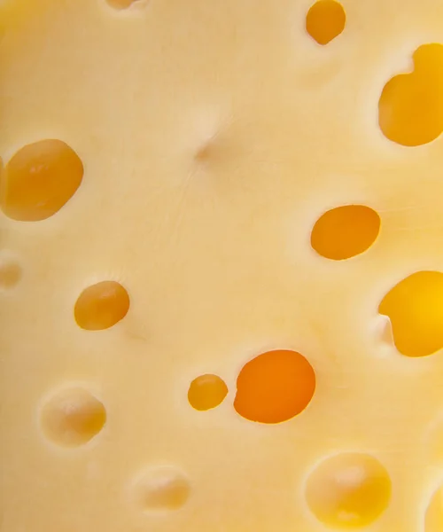 Yellow cheese texture as background — Stock Photo, Image