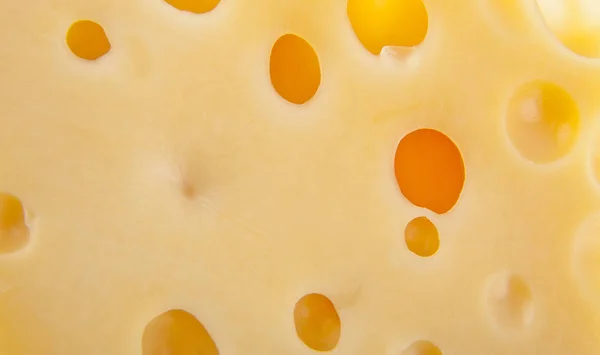 Textura de queijo amarelo como fundo — Fotografia de Stock
