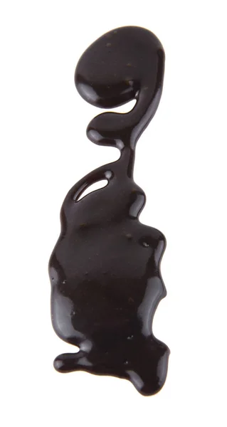Chocolate líquido isolado sobre fundo branco — Fotografia de Stock