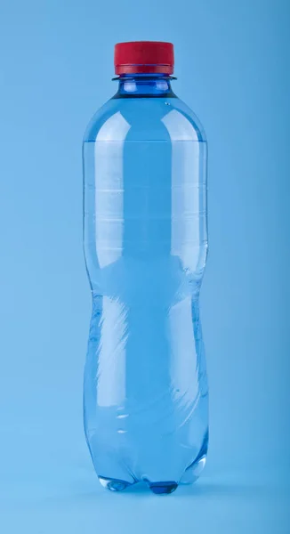 Plastic bottle on a blue background — Stock Photo, Image