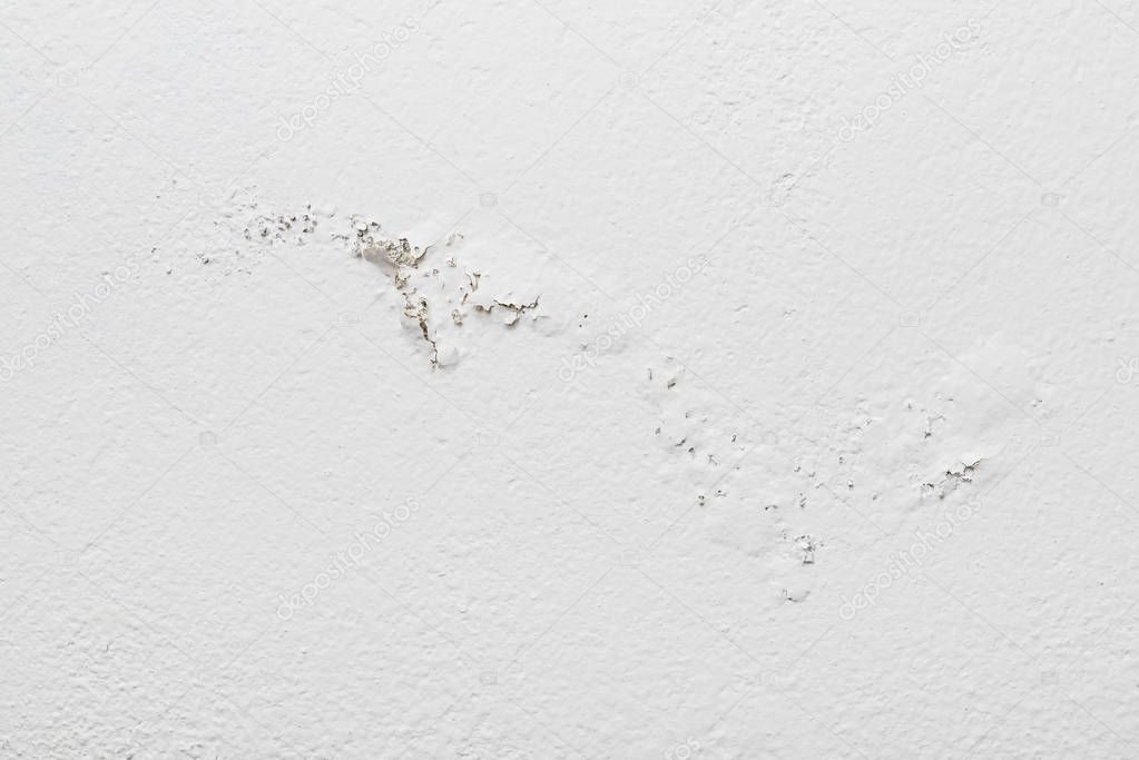Moisture damaged white wall