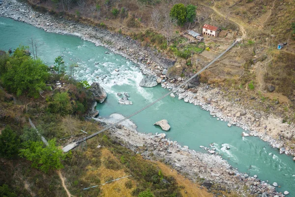 Aerial view of small suspension bridge in Nepal — Stock Photo, Image