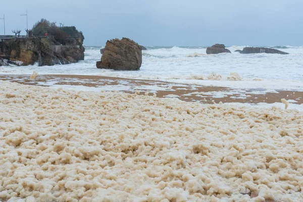 Foam on the Grande Plage beach and its quay, France — Stock Photo, Image