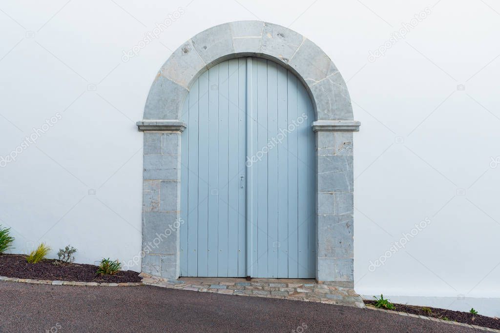 Light blue arched door