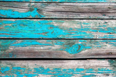 Eski ahşap arka plan. Köhne ahır ahşap kaplama, düğümler ve çivi delikleri, ahşap yüzeyde eski boya kalıntıları. Geniş çatlaklar