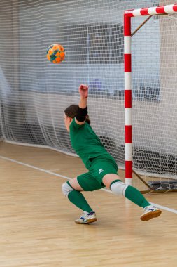 ODESSA, UKRAINE - March 13, 2020: Futsal Cup of Ukraine, futsal among students. During final match in futsal among student teams. Beautiful sports girls play mini football on parquet floor