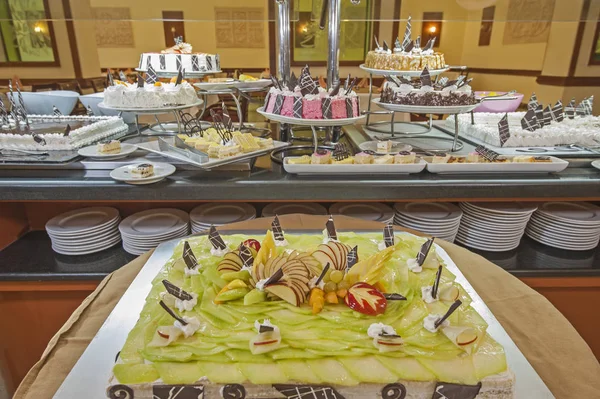 Selection of desserts on display at a restaurant buffet — Stock Photo, Image