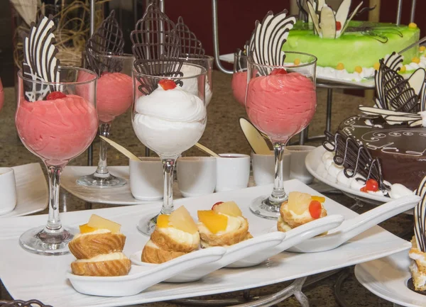 Selection of desserts on display at a restaurant buffet — Stock Photo, Image