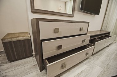 Dressing table chest of drawers in apartment bedroom clipart