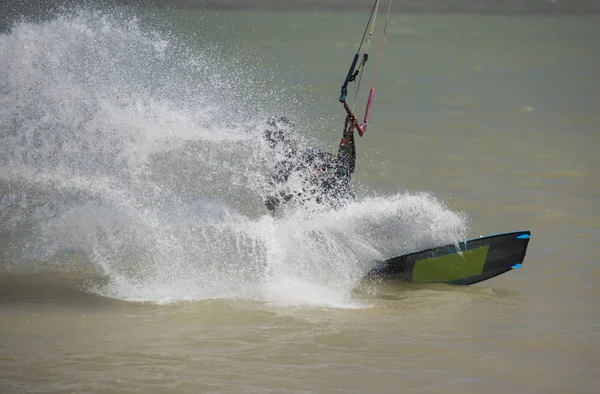 Kitesurfer in action on tropical sea