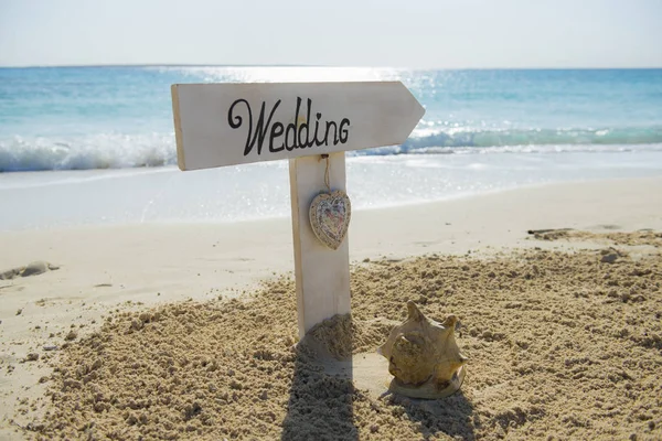Wedding sign on a tropical beach paradise