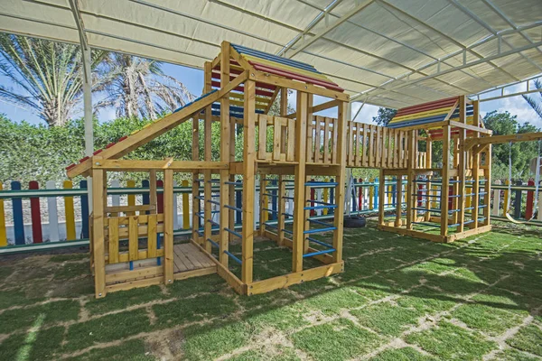 Large wooden climbing frame in children's playground area — Stock Photo, Image