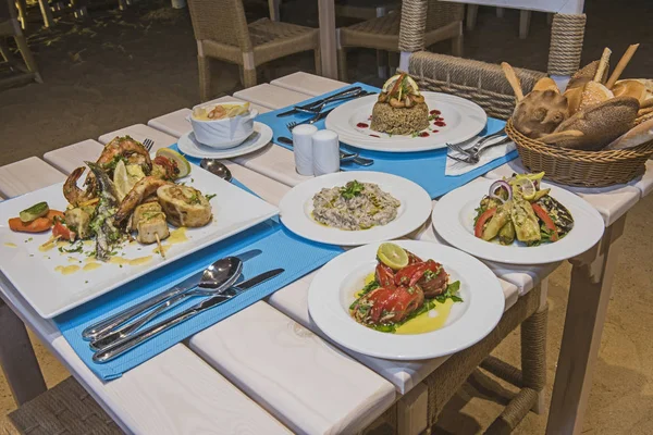 Seafood meal setting in a la carte outdoor restaurant — Stok fotoğraf