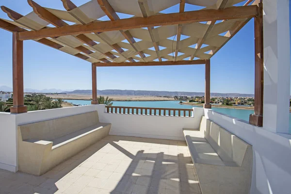 Roof terrace balcony with lagoon view in luxury villa — Stok fotoğraf