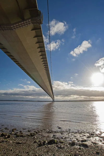 Large Suspension Bridge Spanning Wide River Estuary Clear Day Blue — Stock Photo, Image