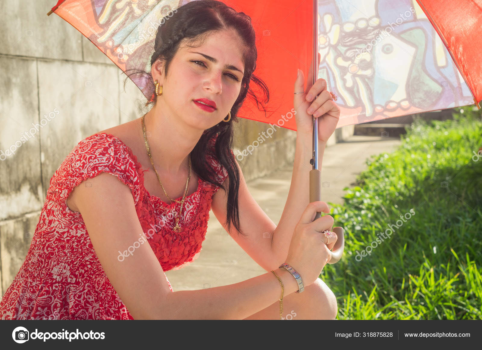 Girl With Black Hair Green Eyes And Red Dress Stock Photo