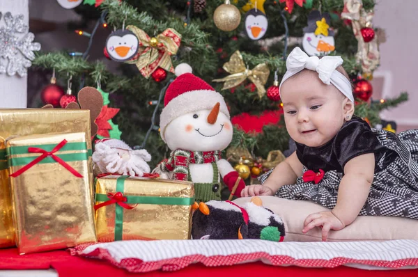 A white baby in Christmas tree decoration — Stock Photo, Image