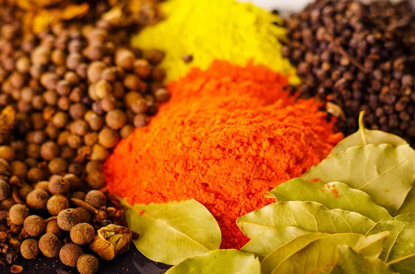 Closeup from above different piles of colorful spices, beautiful rustic setting, spice and herbal concept — Stock Photo, Image