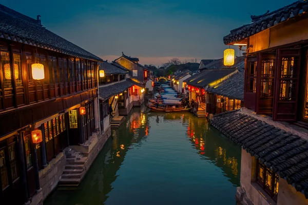 SHANGHAI, CHINA: Beautiful evening light creates magic mood inside Zhouzhuang water town, ancient city district with channels and old buildings, charming popular tourist area — Stock Photo, Image