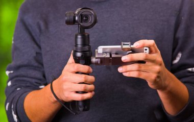 Hand held camera stabilizer for cell phone clipart