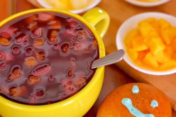 Yellow bowl with traditional tasty latin american colada morada berry juice, symbolizing blood from those deceased, day of the dead concept — Stock Photo, Image