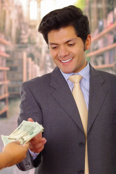 Corrupted young businessman accepting some money from a crook — Stock Photo, Image