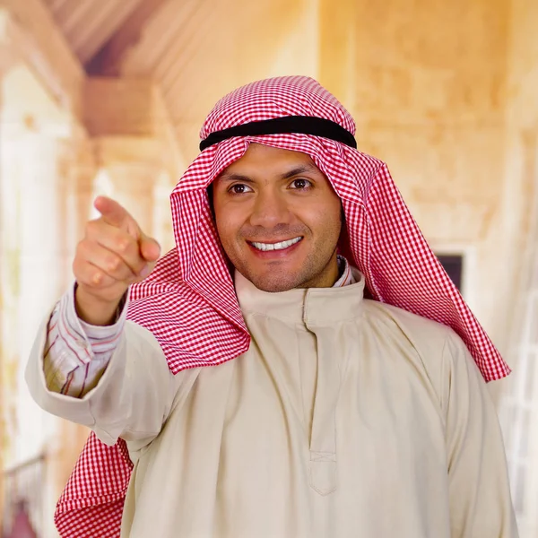 smiling cute young arabian man posing happy
