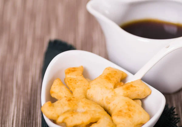 Delicious ecuadorian pristinos piled up in bowl, traditional andean pastry, cheese platter and coffee cup sitting besides — Stock Photo, Image