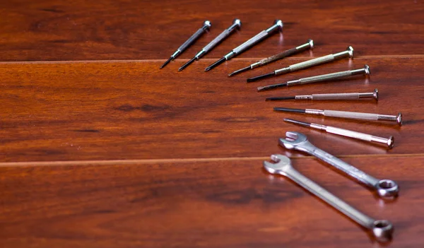 Construction tools,flat wrenches and screw on wooden background — Stock Photo, Image